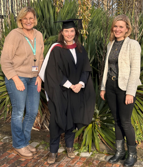 Ashleigh Harding celebrating graduation with the Cabot team